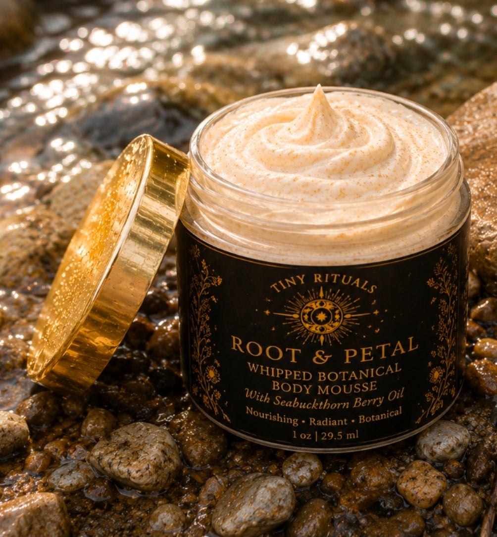 Root & Petal Whipped Botanical Body Mousse open jar showing sheer cream mousse on river rocks